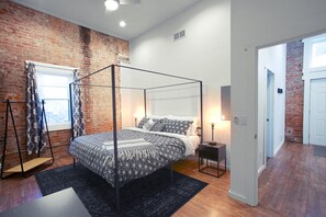 Bedroom #1 featuring a king sized bed and a private bathroom.