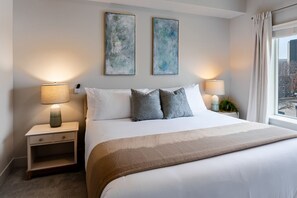 King Bedroom luxuriously designed. 55"TV. Extremely comfortable with an attached bathroom and walk in closet.
