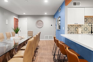 Enjoy seamless dining with the kitchen just steps away—perfect for effortless meals and entertaining.