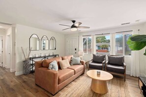 As you enter, you're greeted by a cozy and stylish living space designed for relaxation.