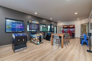 Spacious game room featuring multiple games for hours of family fun and friendly competition.