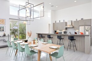 Stunning interior design, a chic dining area, and chef's kitchen. (Polo Villa 8)