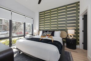 Nashville Nightlife's primary bedroom features a king bed, TV, and ensuite bathroom.