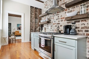 Bright living area with comfy seating and exposed beams.