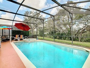 - Splash into fun in your own private pool and unwind in the bubbly spa
- Bright umbrellas and striped loungers bring out that festive vacation vibe
- Lounge in peace with a beautiful green backdrop and no rear neighbors in sight