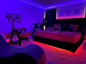 🔥 Enter Your Fantasy Escape 🔥
Moody red lights. King bed. Spanking bench. . A full wall of premium restraints. This luxurious adult retreat is built for bold nights and intimate adventures.