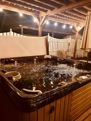 Hot tub seats six and has dual jet settings.