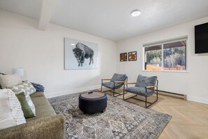 Where rugged beauty meets cozy elegance—unwind in a space inspired by the buffalo of South Dakota.