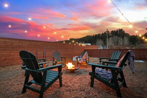 A glowing firepit, the scent of woodsmoke, and pure tranquility.