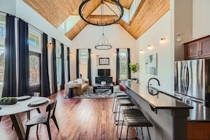 A bright, open-concept kitchen flows seamlessly into the dining area for effortless entertaining.