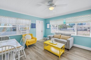 Gather for games or plan your beach days in this cheerful living space.