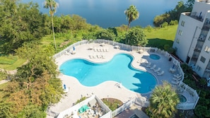 Outdoor swimming pool with jacuzzi and sun loungers