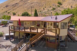Large deck with riverfront view and access. A great space for family getaways.