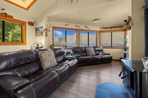 Good size living room area with lots of windows with panoramic views.