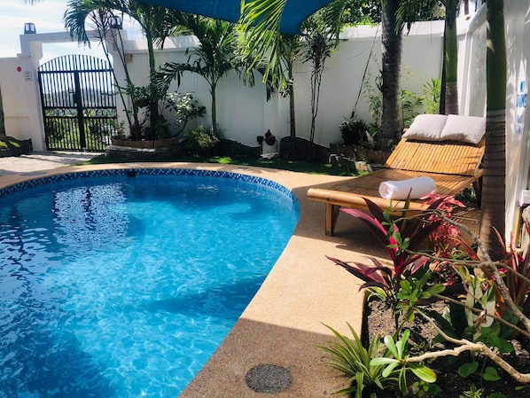 pool area to take a dip and relax with a cold drink from our self service bar 