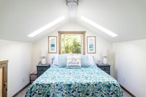Loft bedroom with skylights to look out into the night sky and see the milky way