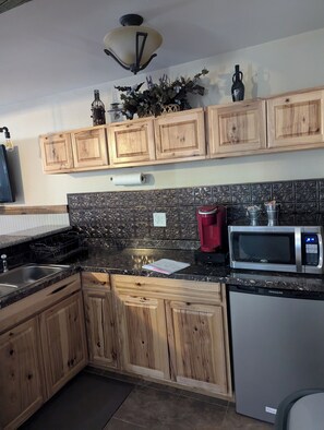 Kitchen equipped with amenities you will need to spend your time 