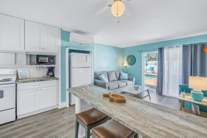 Gather around the bar for island chats and easy living.