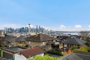 The stunning view of Seattle, featuring the iconic Space Needle, the city skyline, and the waterfront in the background
