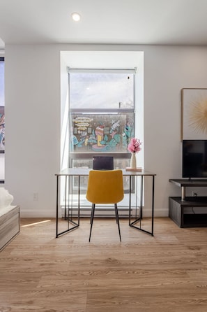 Work Space: A bright, inviting desk setup by the window—ideal for remote work, study sessions, or trip planning