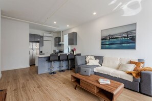 Spacious and practical layout with full kitchen, sectional seating, and a relaxed dining setup