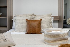 Layered neutrals and soft textures create a calming place to unwind