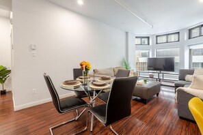 Contemporary dining area with a pop of color and easy access to the relaxed living zone