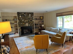 Living room with gas fireplace and Smart TV