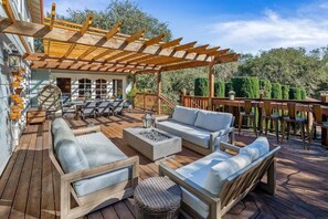 Unwind by the fire pit, where laughter sparks under the night sky.