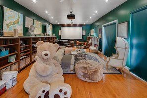 Curl up with a book, enjoy movie nights, or relax alongside the giant teddy.
