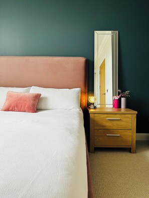 Bedroom with en-suite bathroom and walk-in wardrobe.