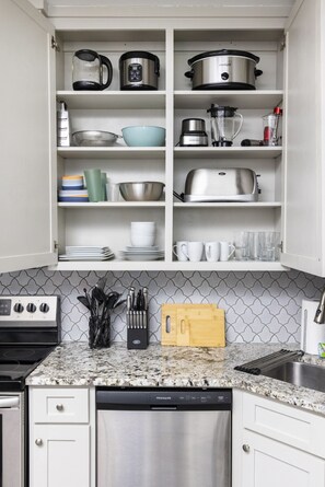 Our kitchen has everything you need! From the sink to the microwave, it's all about convenience and style.