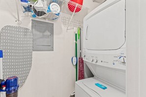 Right off the kitchen is the convenient laundry room with stackable washer & dryer.