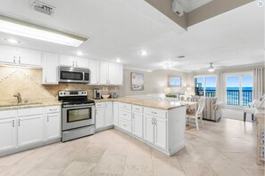 Enjoy cooking in this open, spacious kitchen with everything you need at your fingertips, and a gulf view to boot!