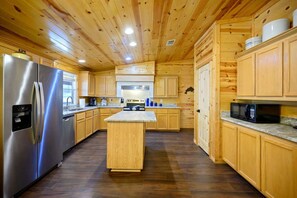 The open kitchen offers loads of space & every home comfort