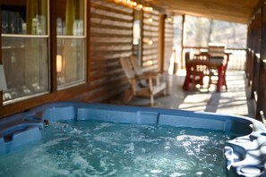 Bask in bubbling bliss with woodland views on the back deck