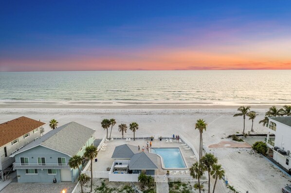 Aerial view of the pool area looking towards the beach.