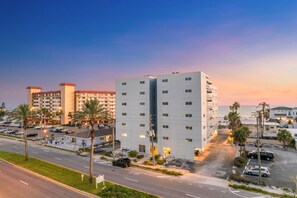 Welcome to San Remo! This building overlooks the beach and its beachfront pool!