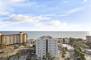Another aerial view of the building with the beach and Gulf right behind it.