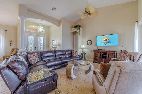 - Relax on a plush leather sectional while watching your favorite shows on a large flat screen TV
- Spacious living area with high ceilings and elegant decor for ultimate comfort
- Perfect for family movie nights, conversations, and cozy lounging