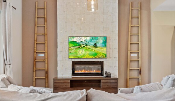 Modern retreat with cozy fireplace, chic decor, and serene artistic touches
