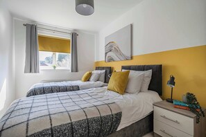 Perfect for friends, siblings, or solo travelers—this bright and cozy room offers restful nights in two comfy single beds. 🌙🛏️