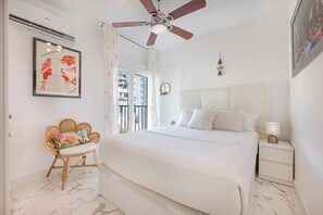 Bedroom: Bright, double bed, TV, fan, and AC, comfortable year-round. (1)