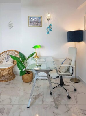 Living Room: Spacious and bright, sofa bed, TV, side table, access to terrace. (3)