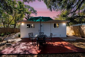 Outdoor furniture with umbrella to enjoy the outdoors peacefully.