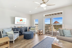 Living room with sliding door access to porch/deck space