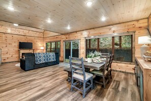 The cozy living room is perfect for relaxing with family. Equipped w/ smart TV.