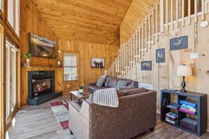 Living area to gather around the gas fireplace