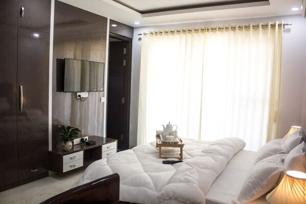 A cozy bedroom scene with a cup of tea on a bedside table, offering a warm and comforting atmosphere 