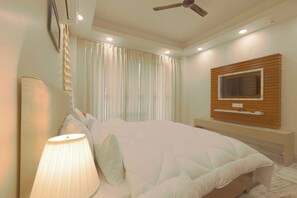 A luxurious living room adorned with high-end furnishings, exquisite decor, and state-of-the-art amenities, exuding elegance and opulence.